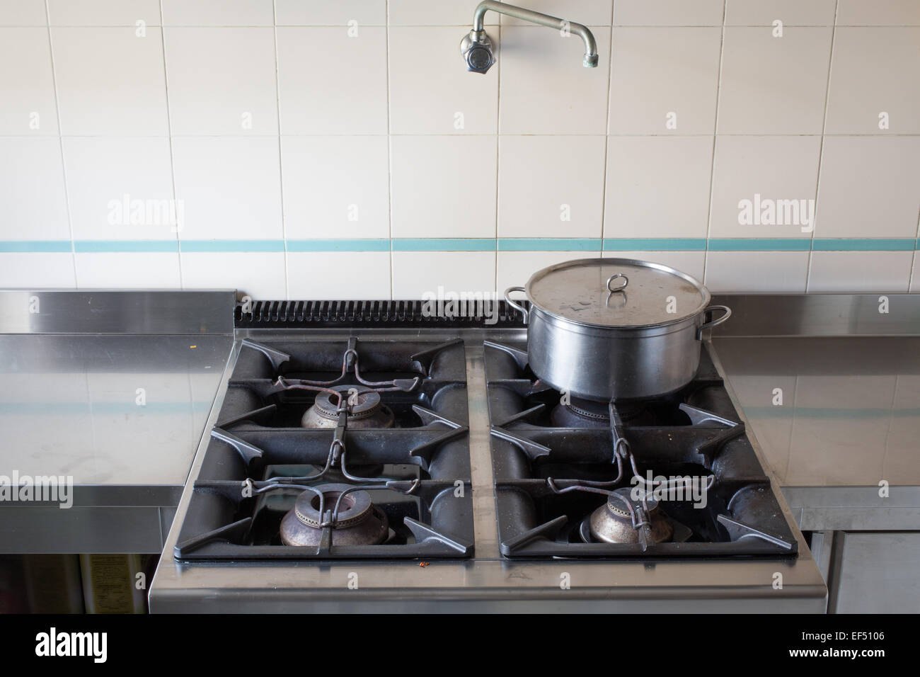 https://c8.alamy.com/comp/EF5106/steel-large-pot-over-the-stove-of-industrial-kitchen-in-stainless-EF5106.jpg