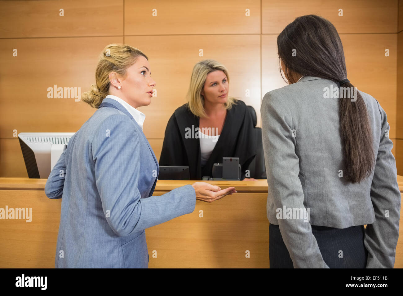 Lawyers speaking with the judge Stock Photo - Alamy