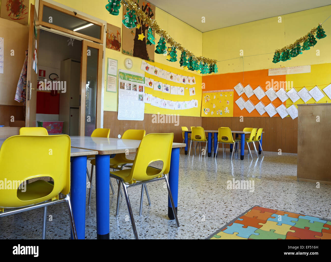 Kindergarten Classroom With Yellow Chairs And Table With