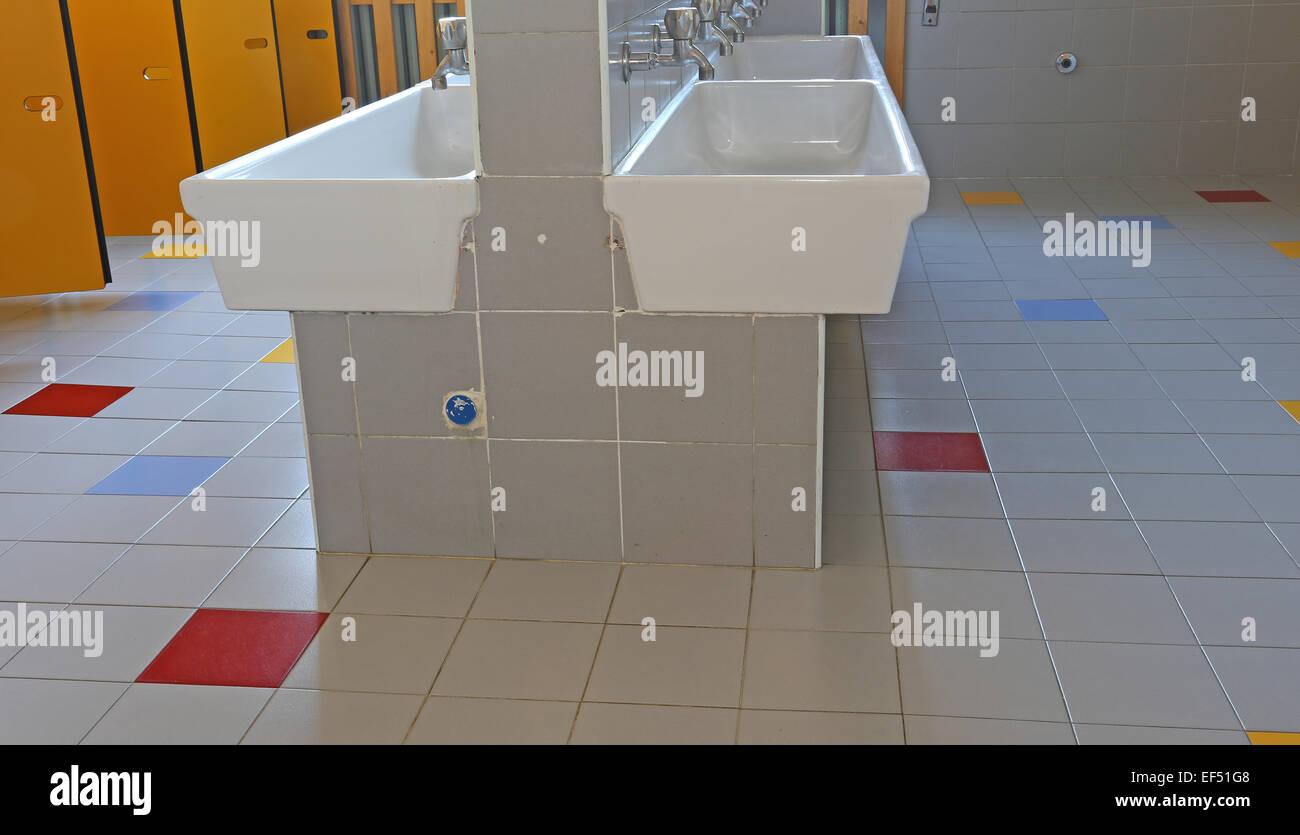inside the bathroom of the nursery school with sinks Stock Photo