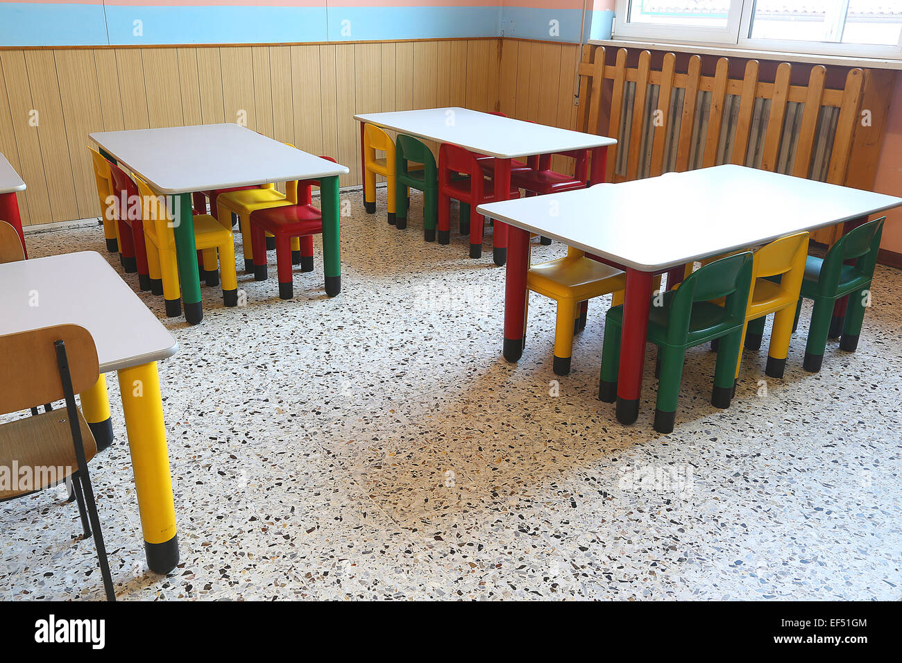 colored plastic chairs and small tables of school refectory for children Stock Photo