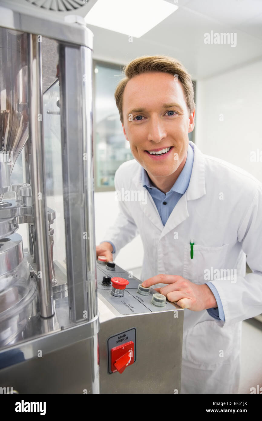 Happy pharmacist using advanced technology Stock Photo Alamy