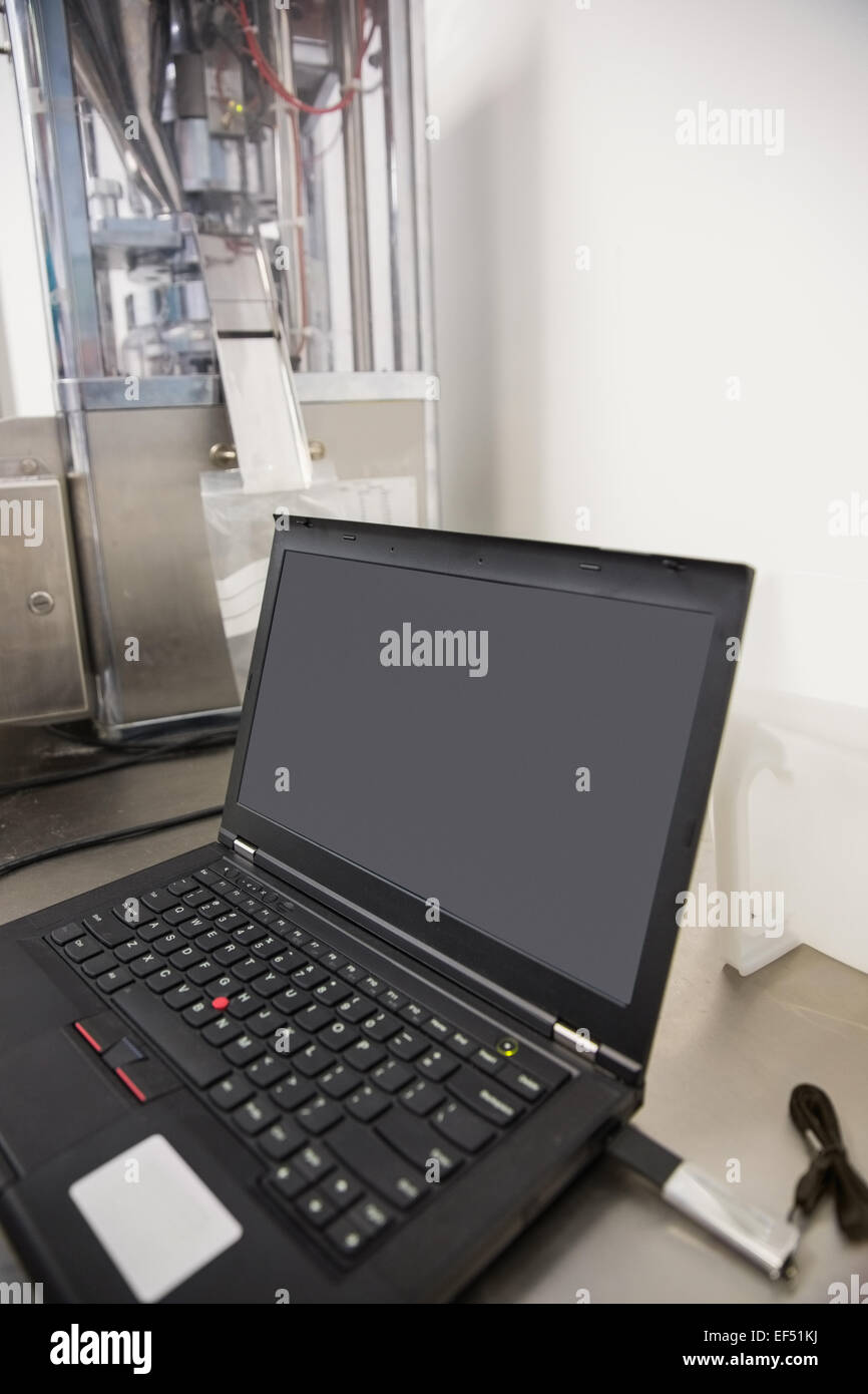 Laptop on desk with blank screen Stock Photo