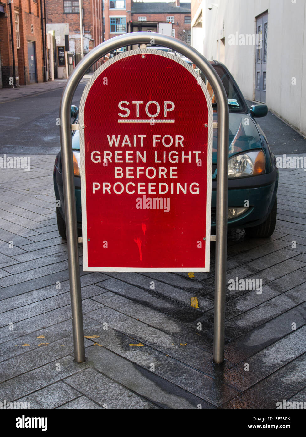 Automatic street security bollards of polished steel with traffic