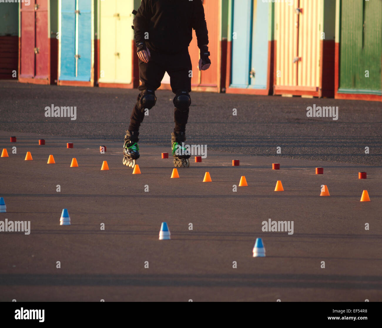 Rollerskating by the beach huts in Hove, Brighton Stock Photo Alamy