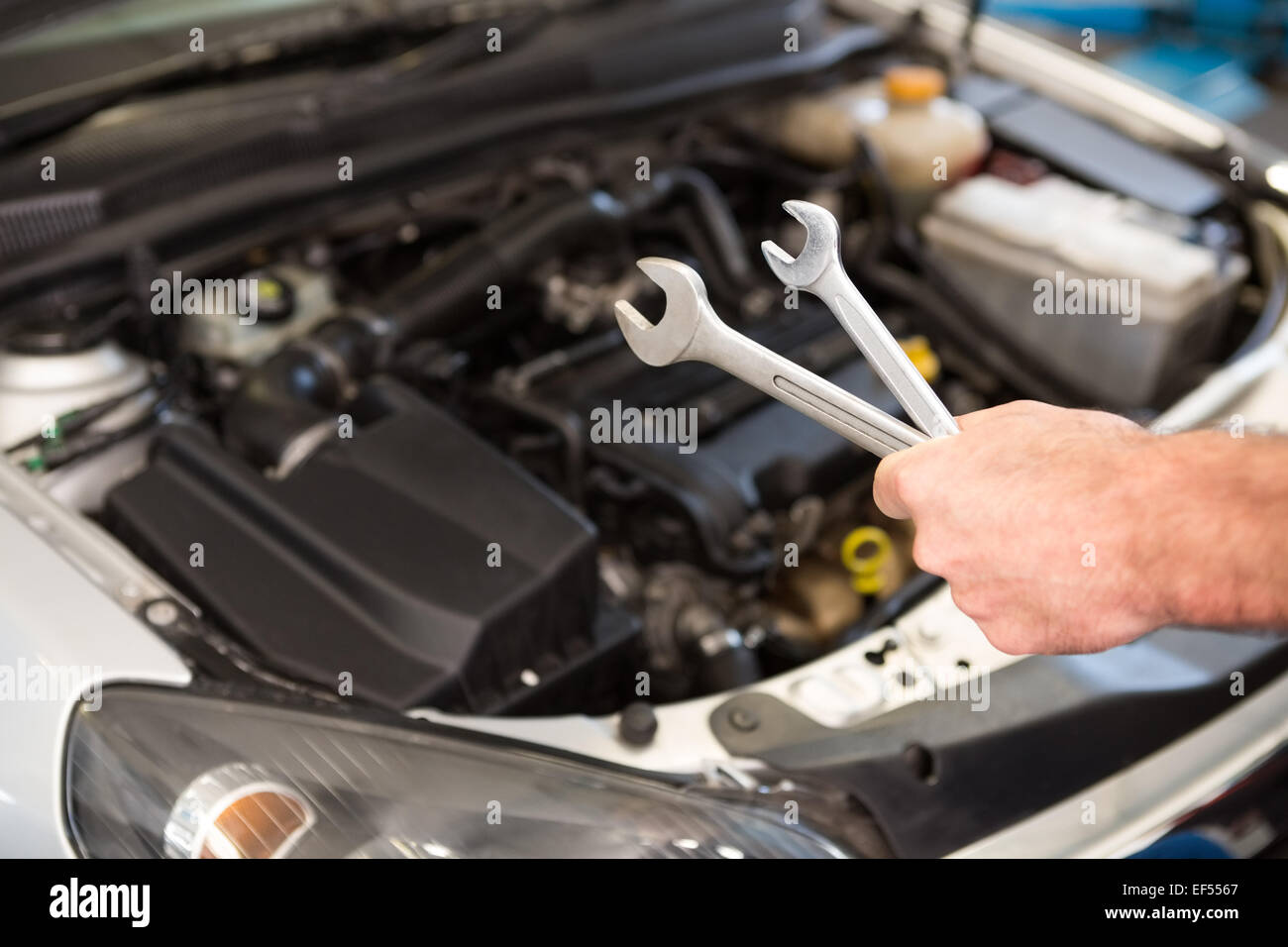 Mechanic holding two types of wrench Stock Photo Alamy