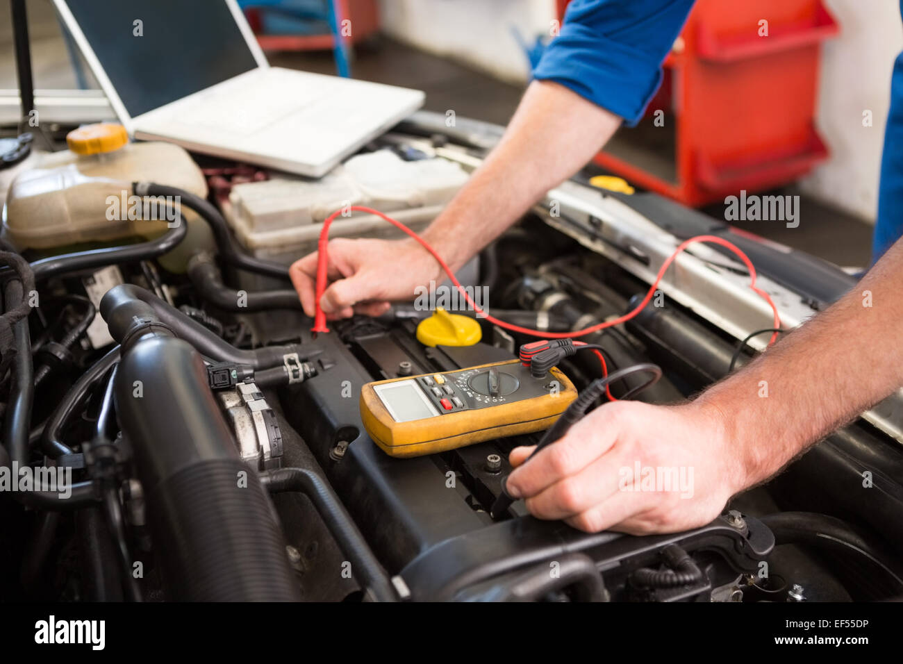 Mechanic using diagnostic tool on engine Stock Photo Alamy