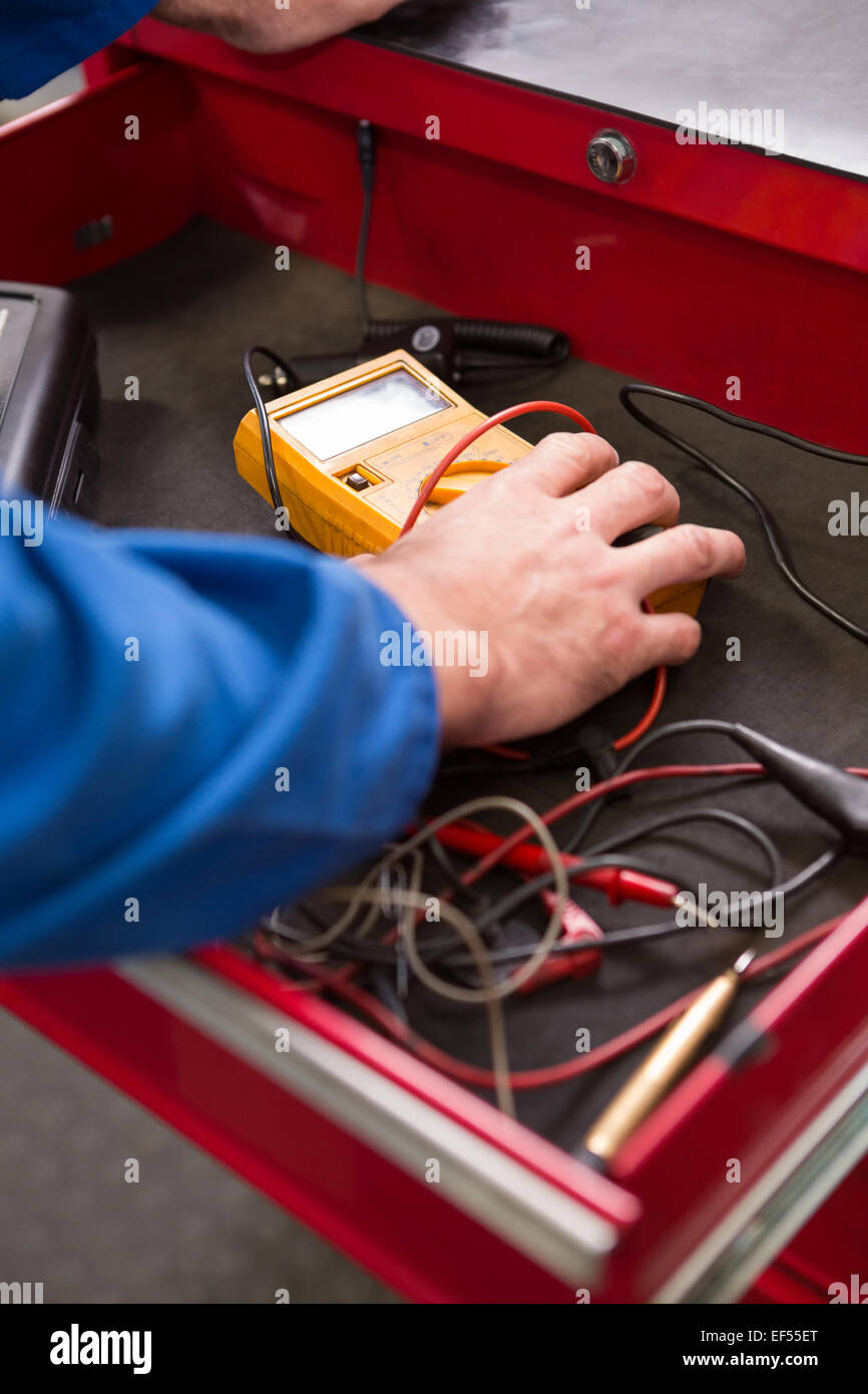 Mechanic taking a diagnostic tool from drawers Stock Photo Alamy