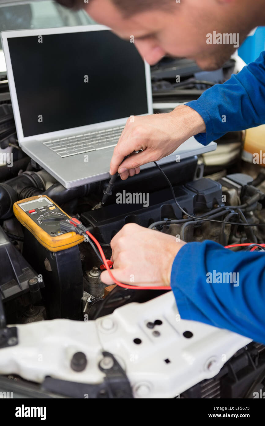 Mechanic using diagnostic tool on engine Stock Photo Alamy