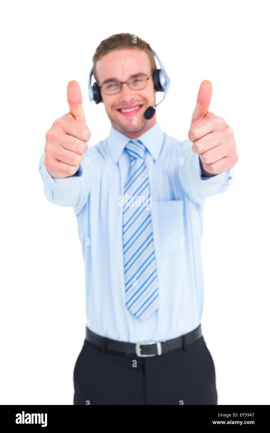 Positive businessman smiling with thumbs up Stock Photo - Alamy