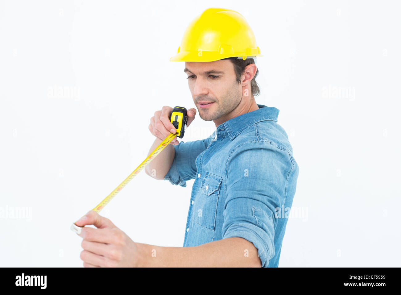 Male architect using tape measure Stock Photo - Alamy