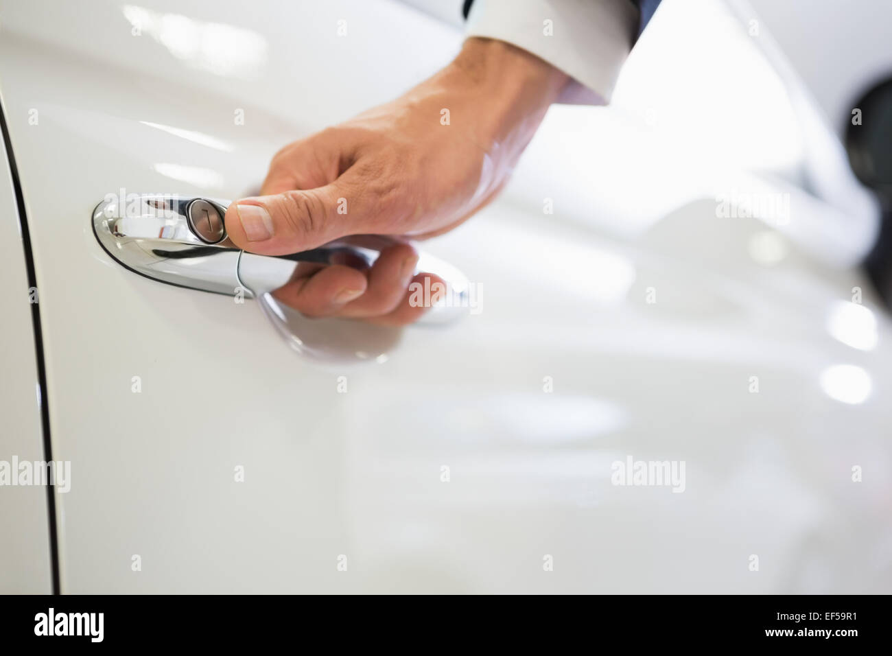 Man holding a car door handles Stock Photo Alamy