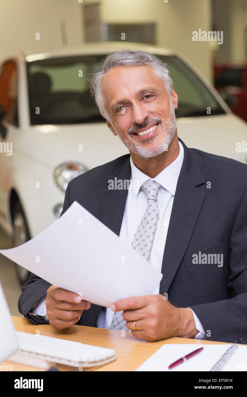 Smiling businessman looking at camera Stock Photo - Alamy
