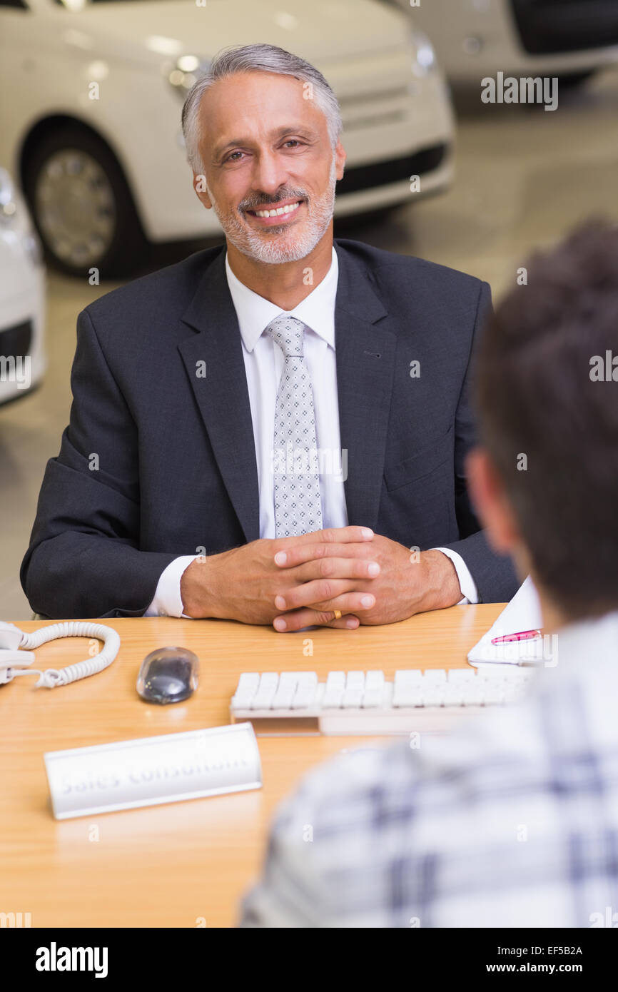 Smiling businessman looking at camera Stock Photo - Alamy