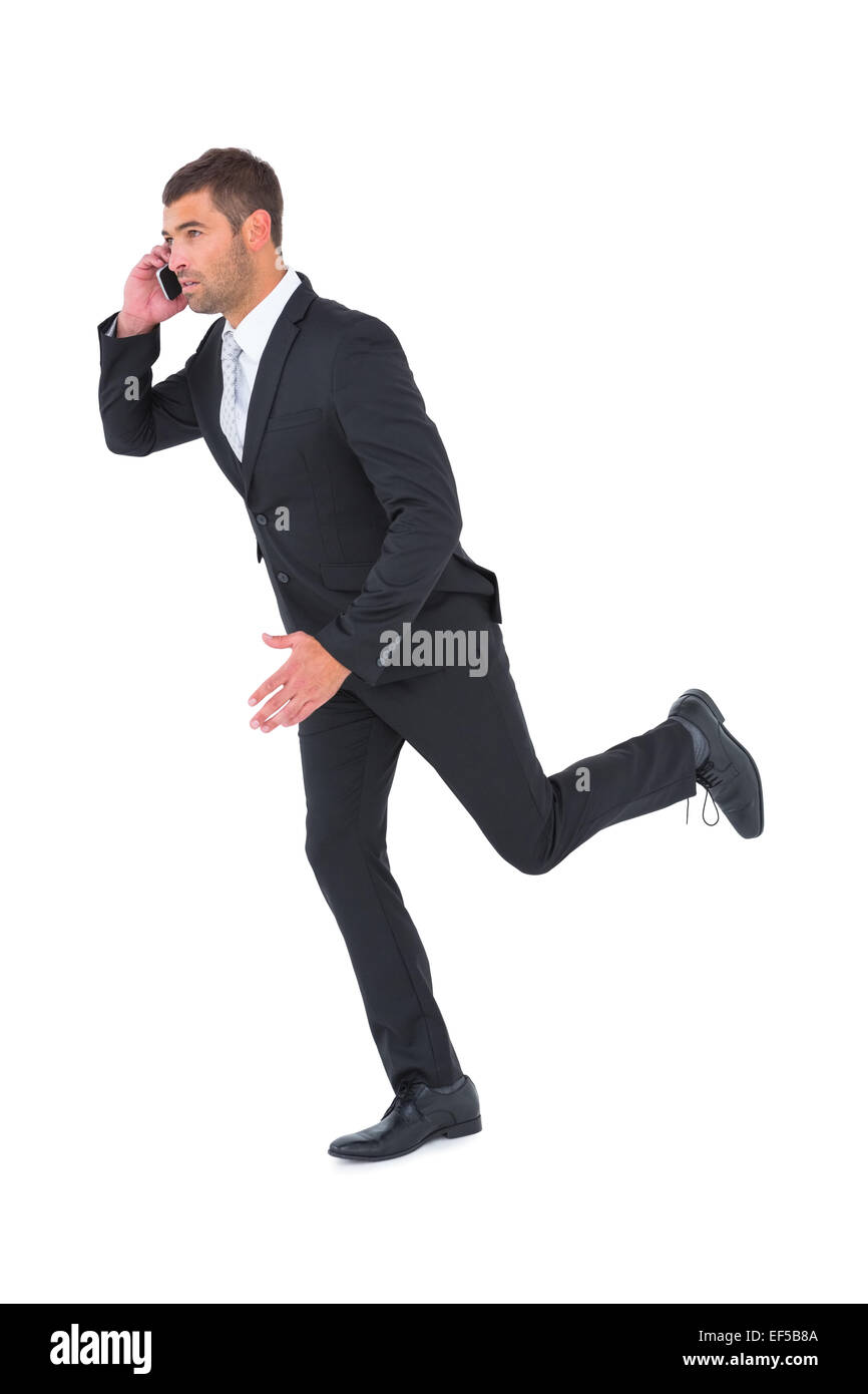 On Phone Rushing Businessman running on the phone Stock Photo - Alamy