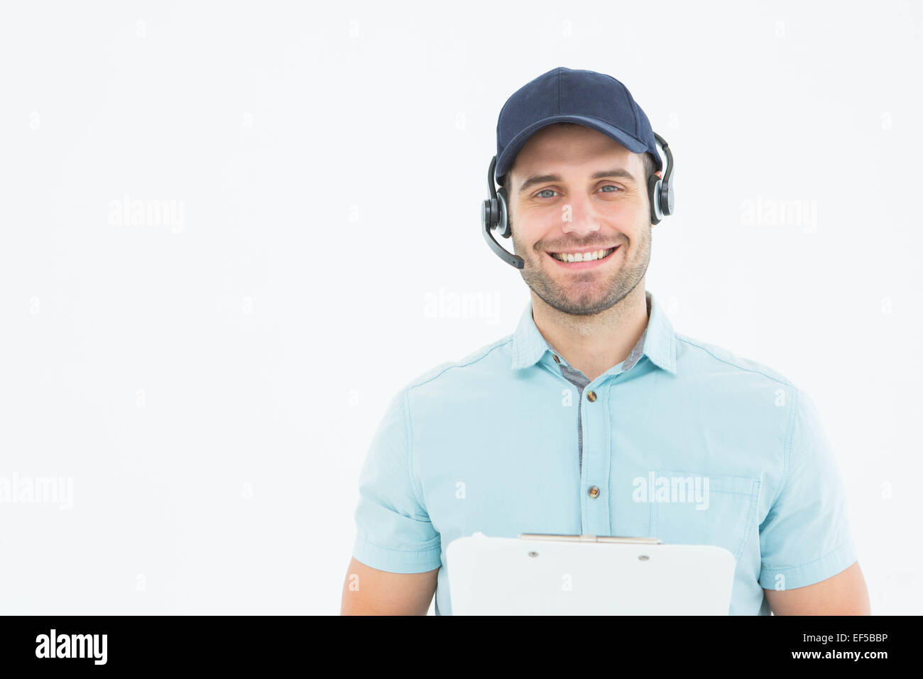 HHappy male courier man wearing headset Stock Photo Alamy