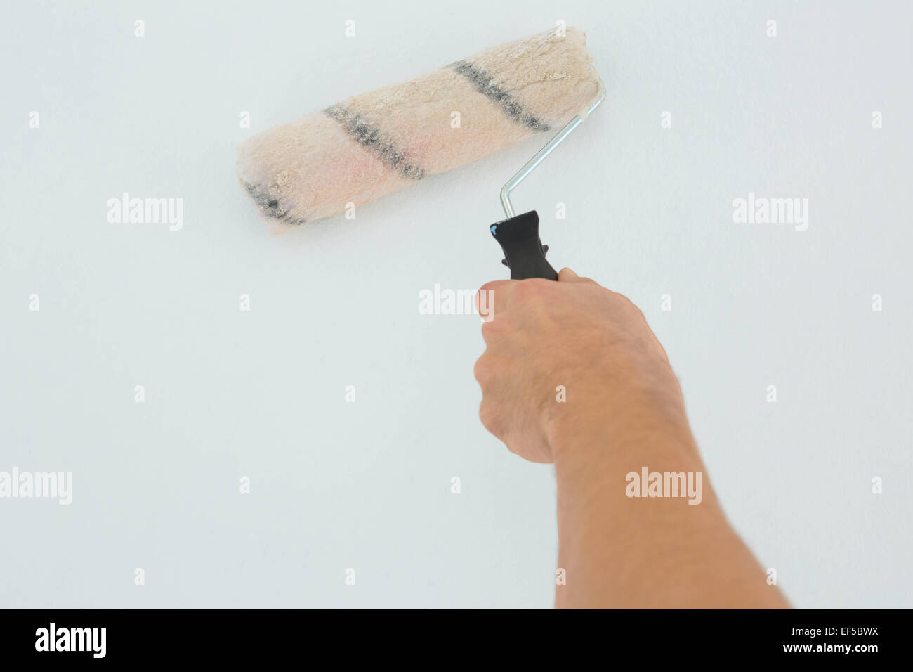 Mans hand using paint hi-res stock photography and images - Alamy