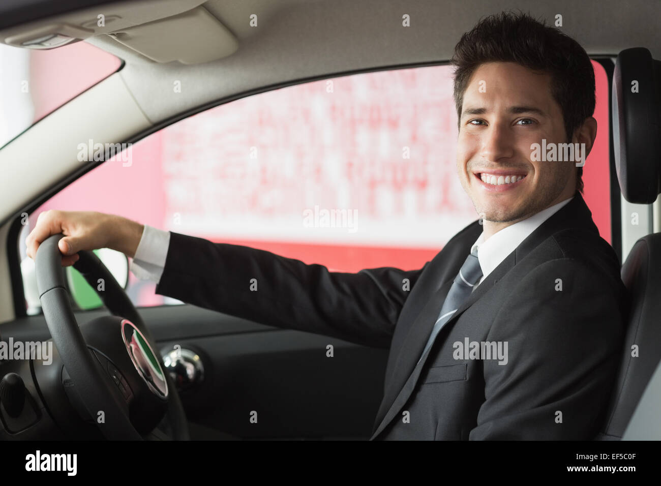 Businessman car smiling steering wheel hi-res stock photography and ...