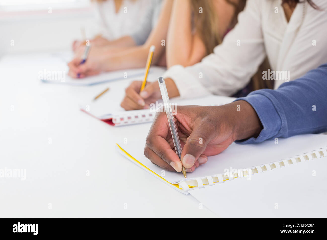 Students taking notes in class Stock Photo - Alamy