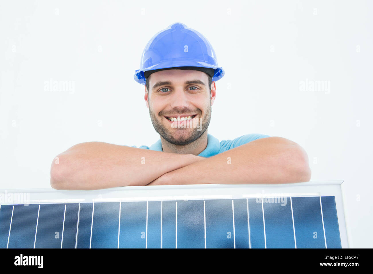 Happy construction worker leaning on solar panel Stock Photo Alamy