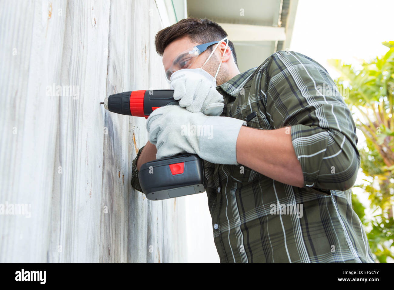 Carpenter using drill machine Stock Photo - Alamy