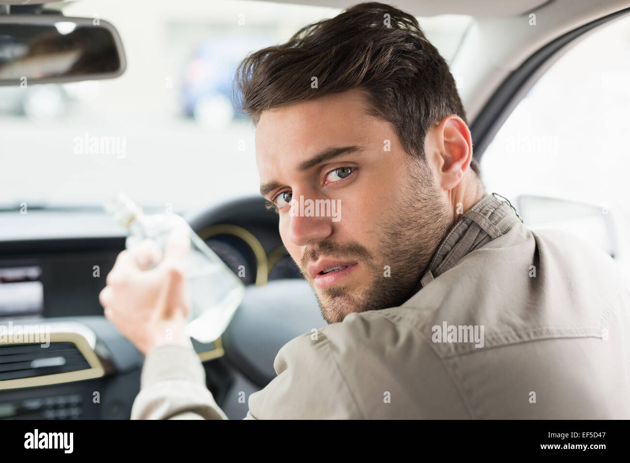 Man drinking alcohol while driving Stock Photo - Alamy