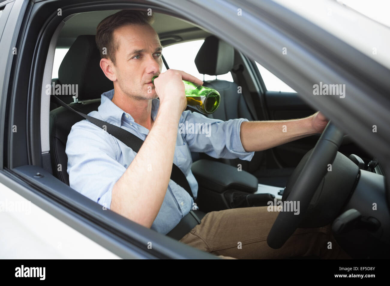 Man drinking beer while driving Stock Photo Alamy