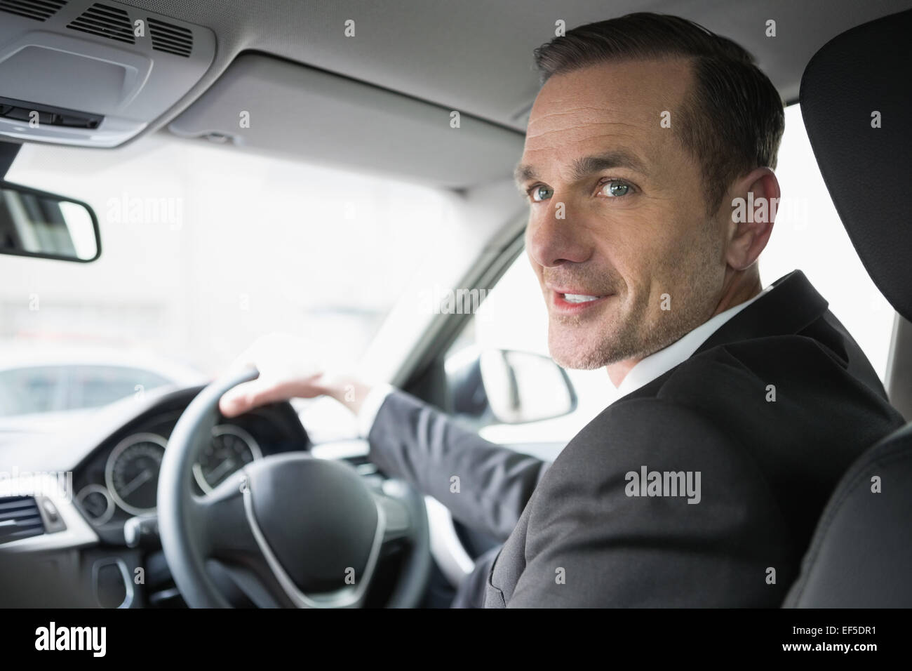 Man tie smiling car steering wheel hi-res stock photography and images ...