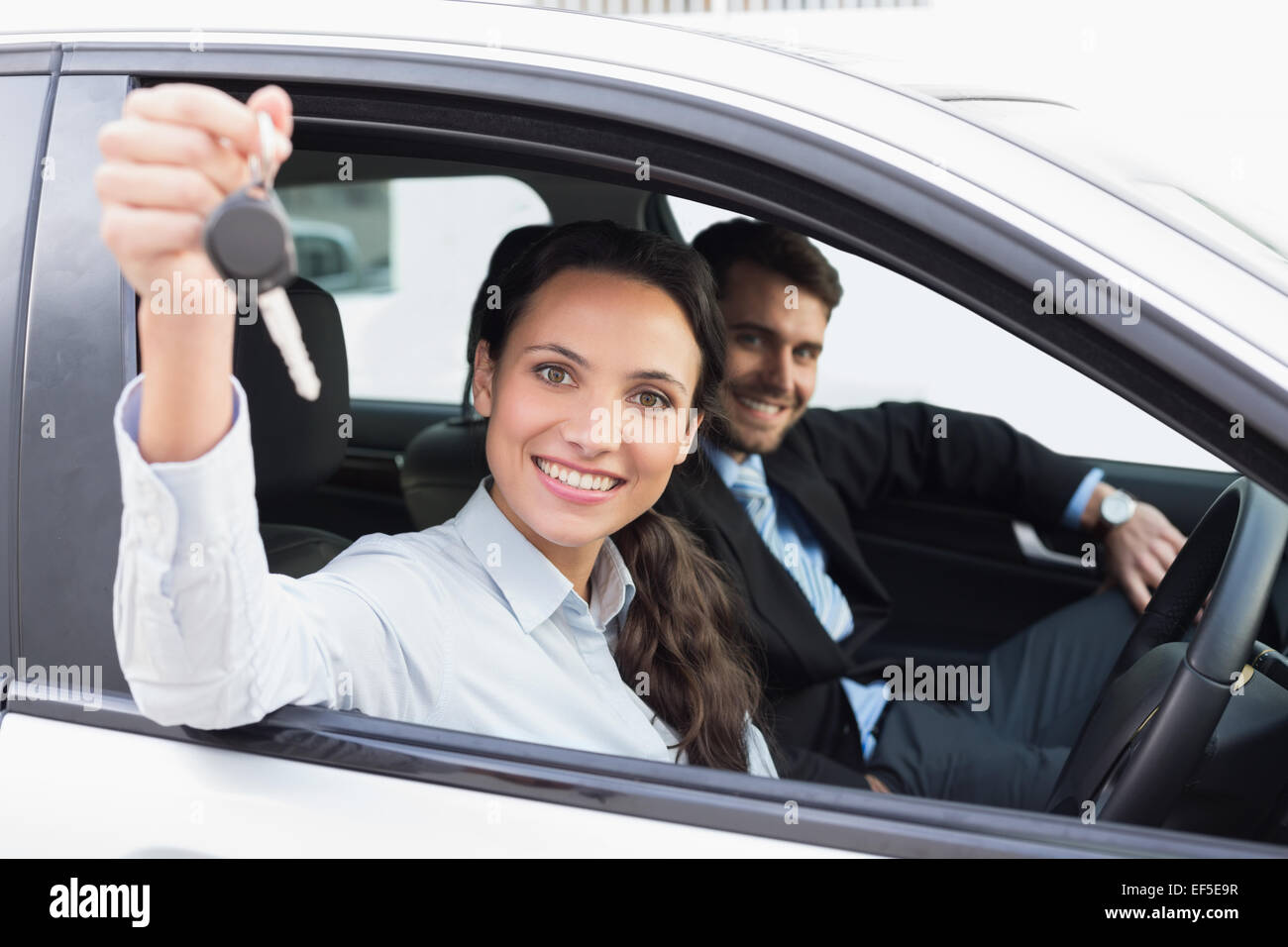 Business team smiling and driving Stock Photo - Alamy