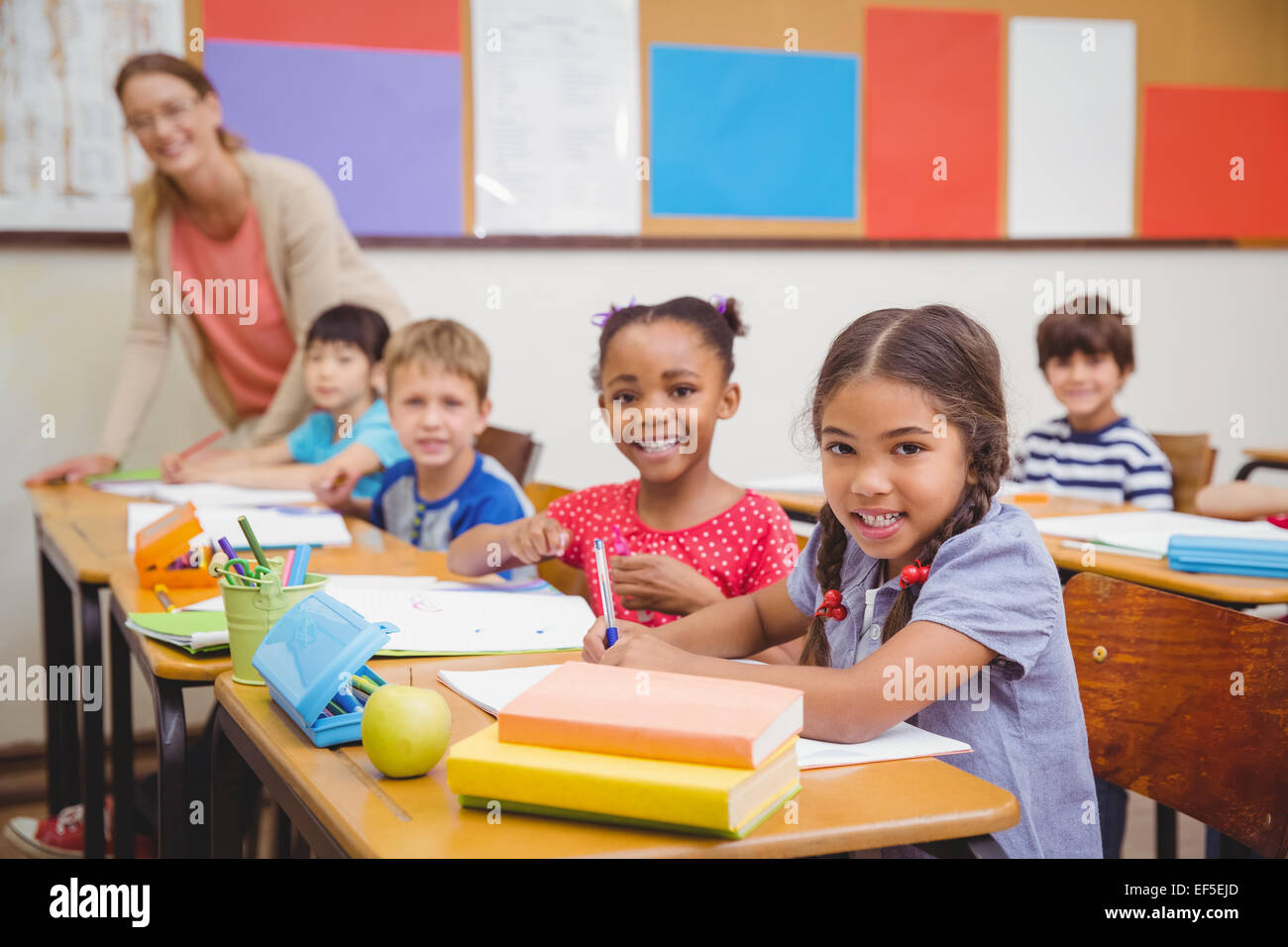 Cute pupils drawing at their desks Stock Photo - Alamy