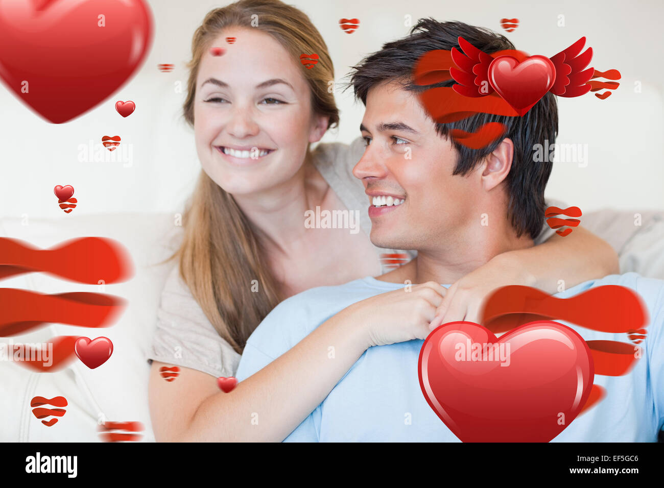 Composite image of close up of a young couple posing Stock Photo