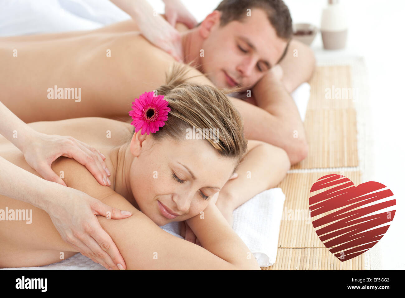 Composite image of relaxing couple having a massage Stock Photo