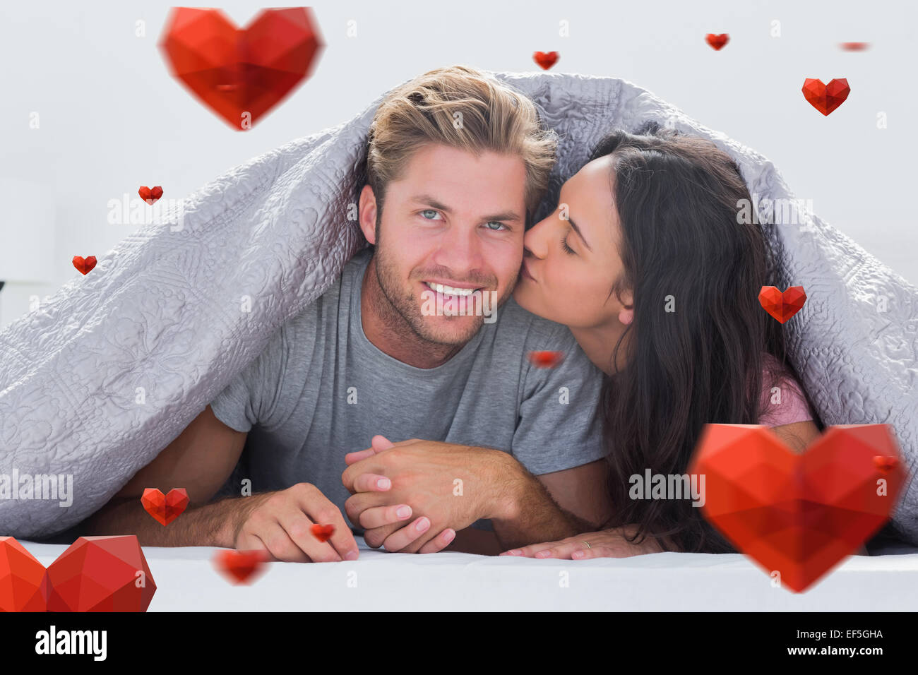 Woman kissing man bed hi-res stock photography and images - Alamy