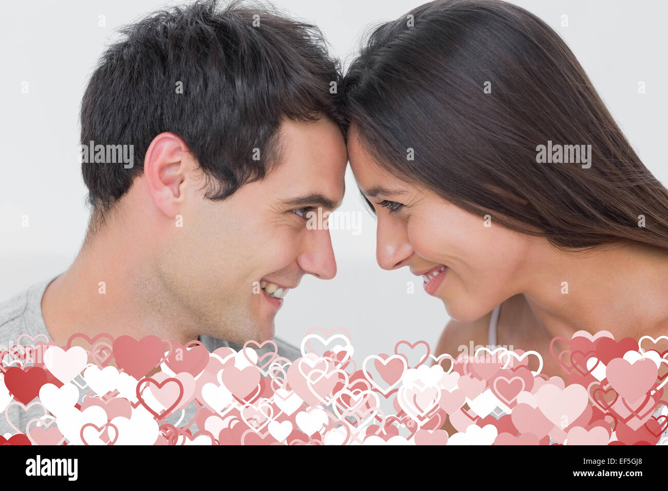 Composite image of couple facing each other Stock Photo