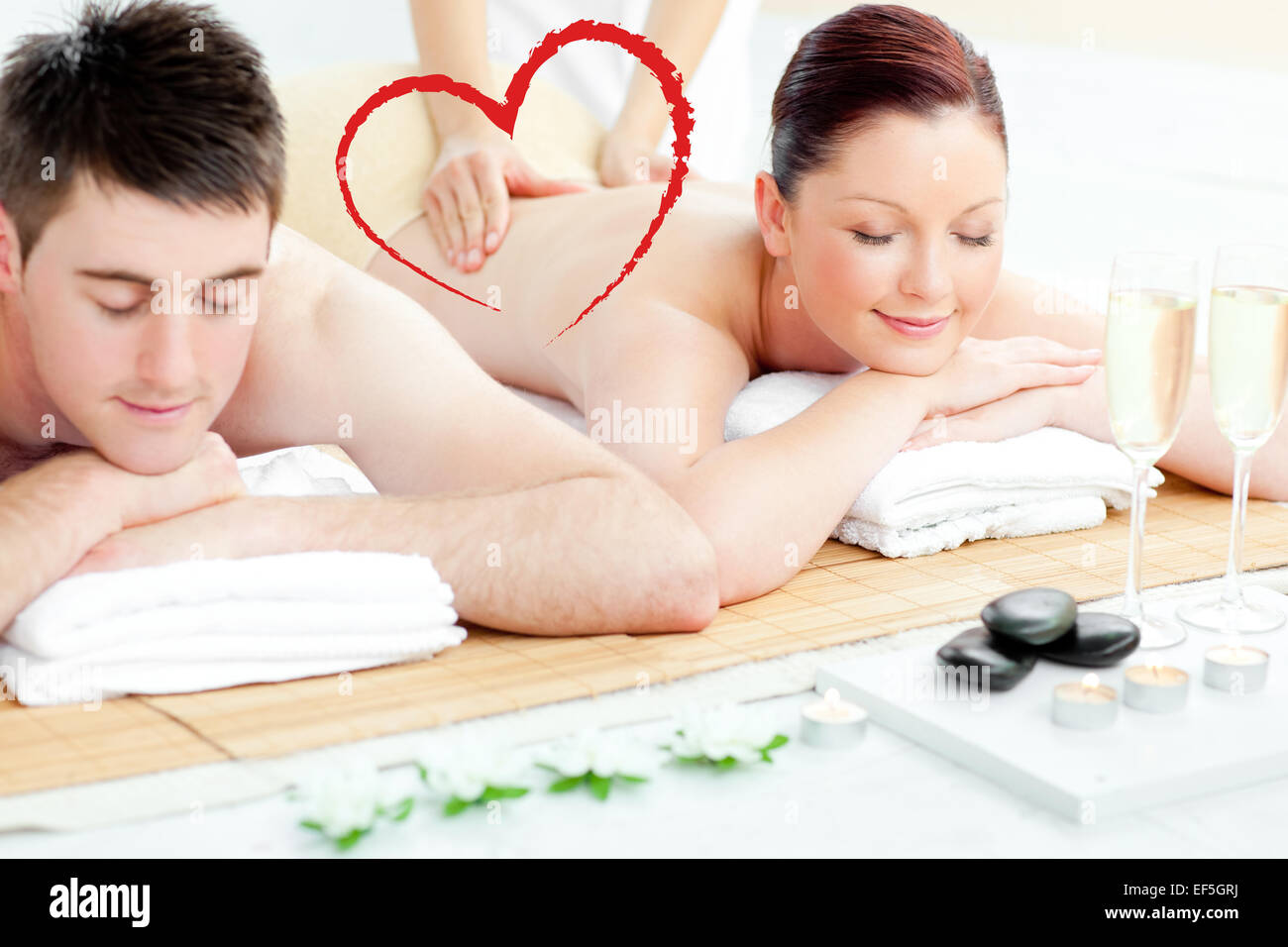 Composite image of charming young couple enjoying a back massage Stock Photo