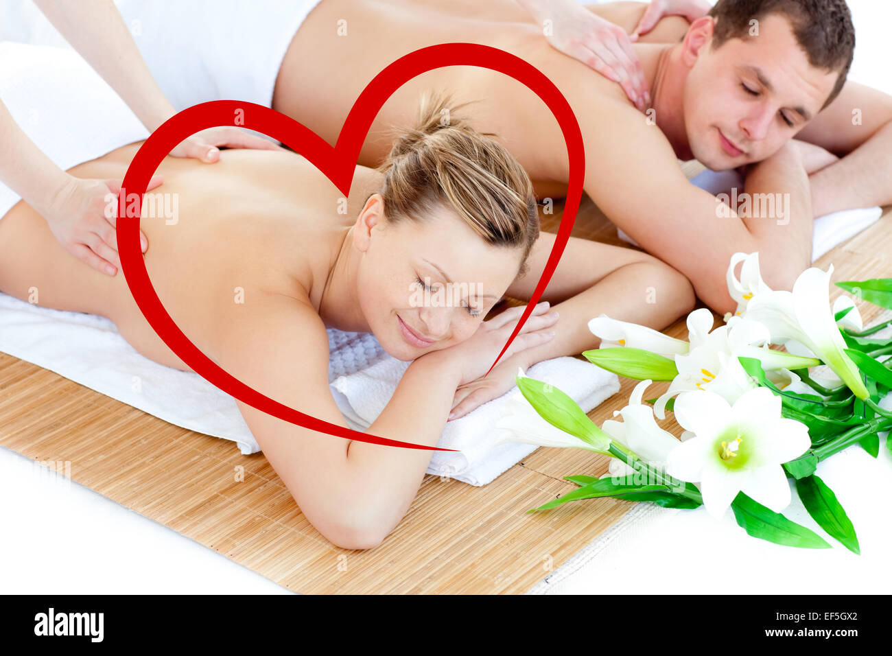 Composite image of loving young couple enjoying a back massage Stock Photo