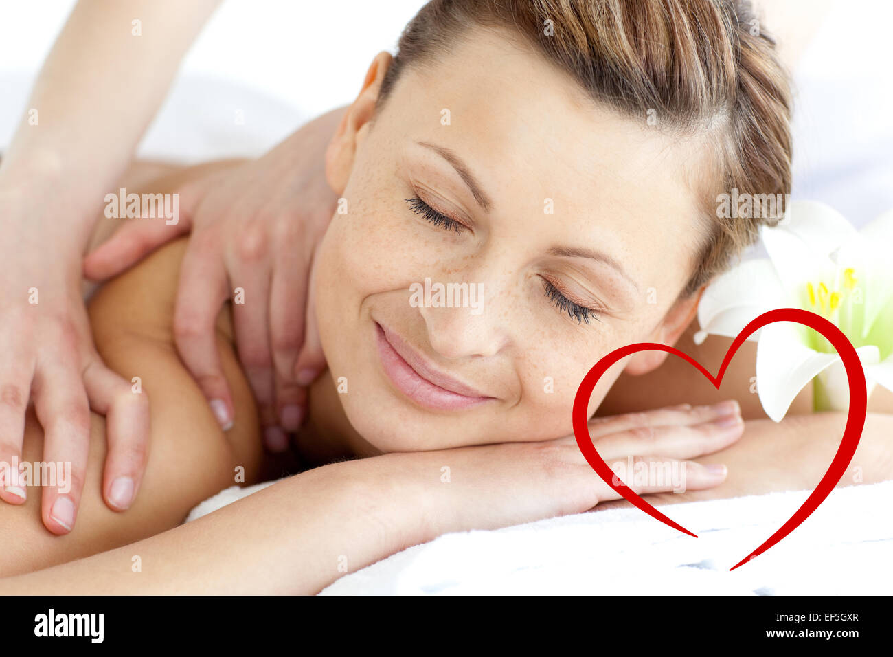 Composite image of young woman enjoying a back massage Stock Photo