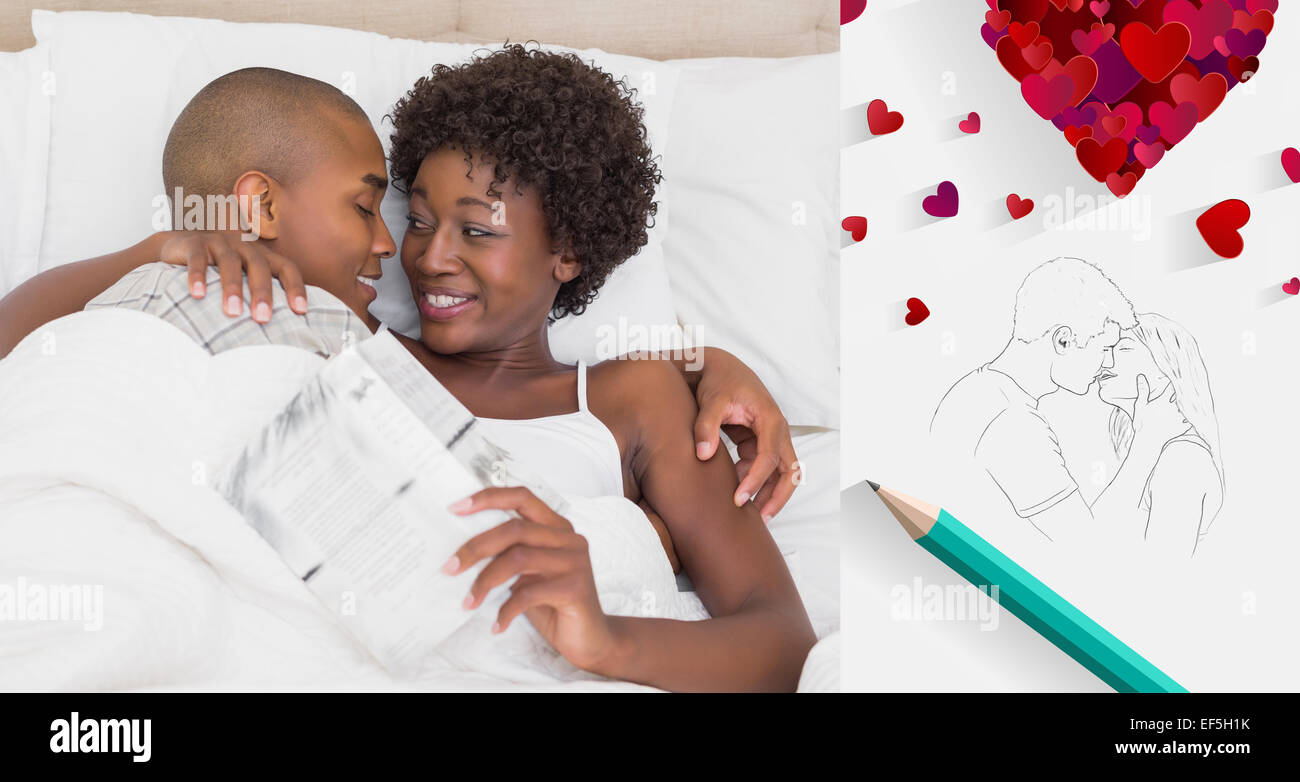 Composite image of happy couple lying in bed cuddling Stock Photo