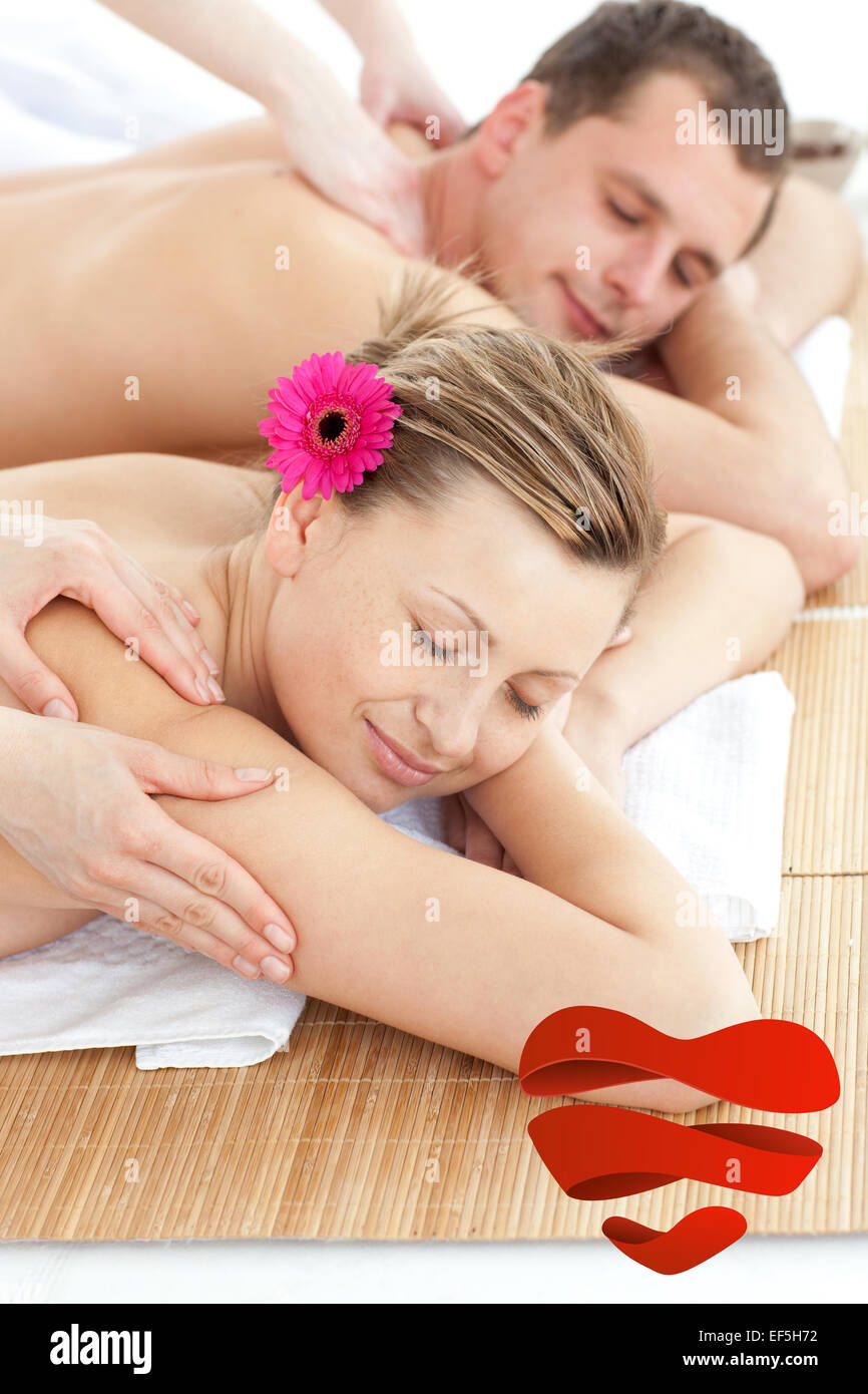Composite image of adorable couple having a massage Stock Photo