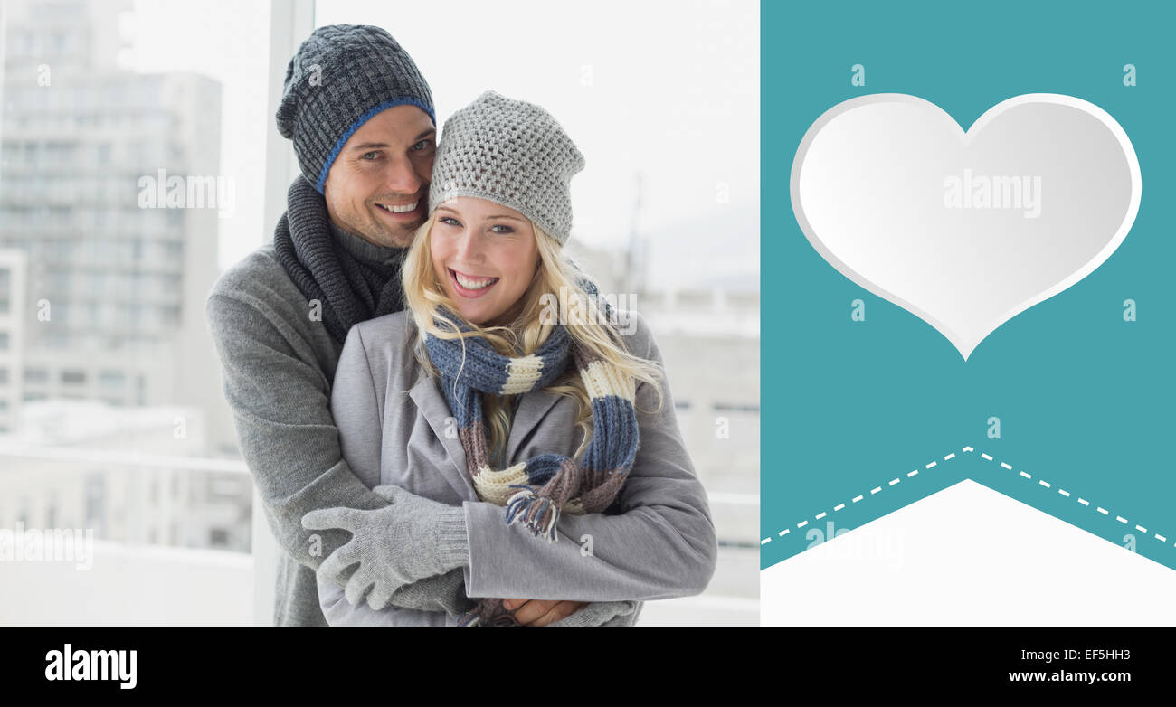 Composite image of cute couple in warm clothing smiling at camera Stock ...