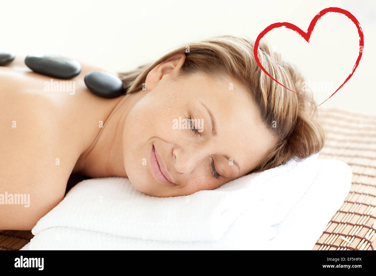 Composite image of beautiful woman receiving a spa treatment Stock Photo