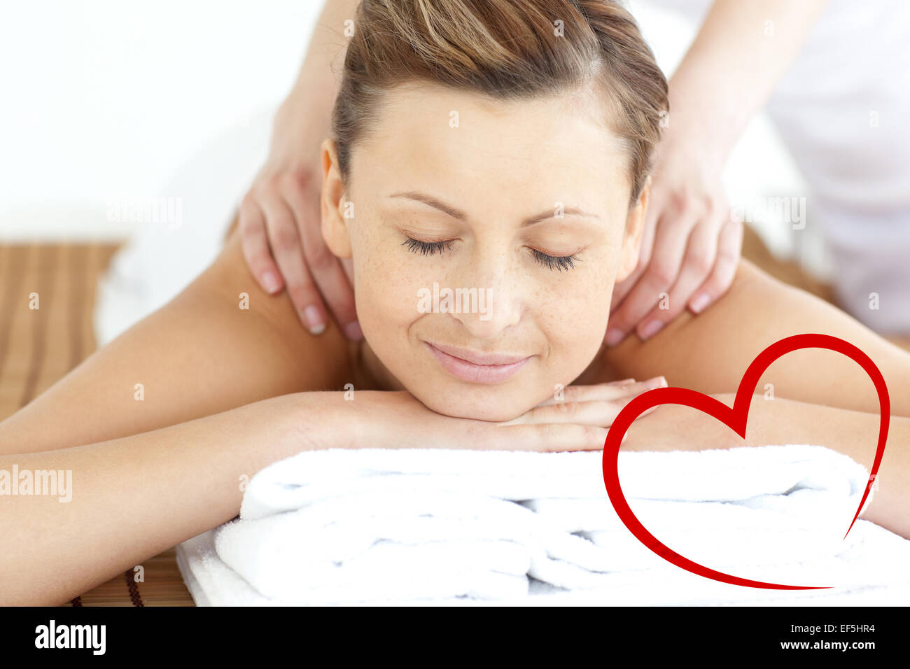 Composite image of relaxed woman enjoying a back massage Stock Photo