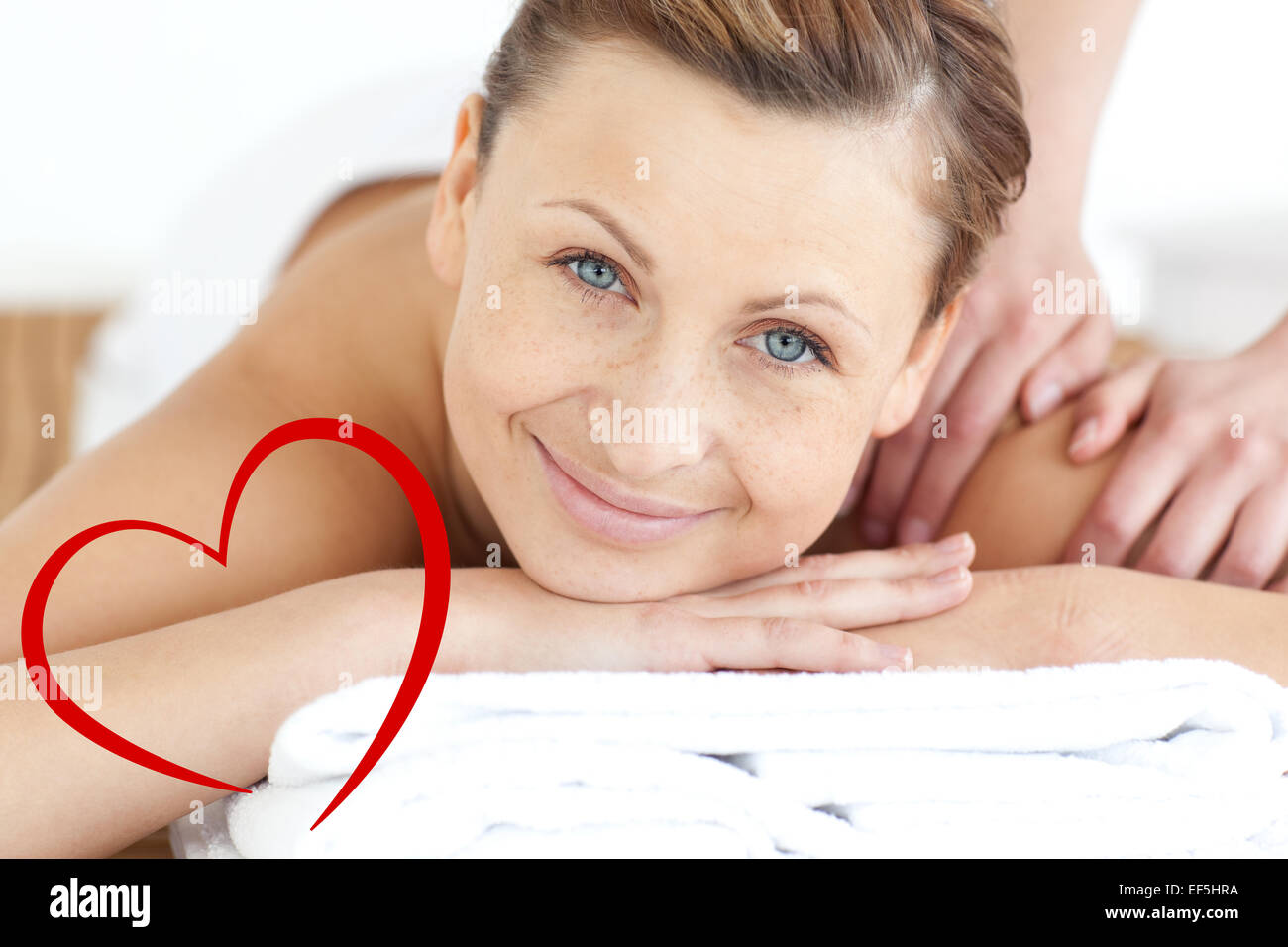 Composite image of charming woman enjoying a back massage Stock Photo