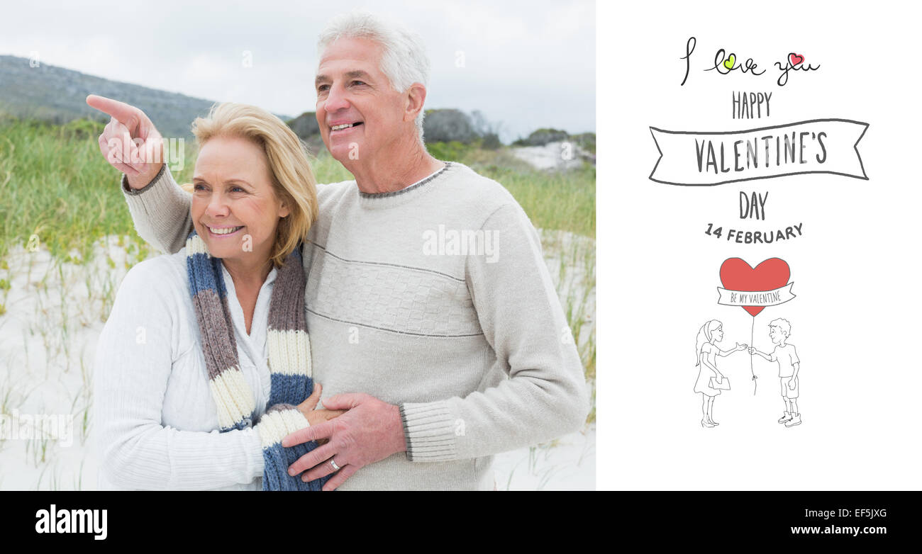 Composite image of cheerful romantic senior couple at beach Stock Photo