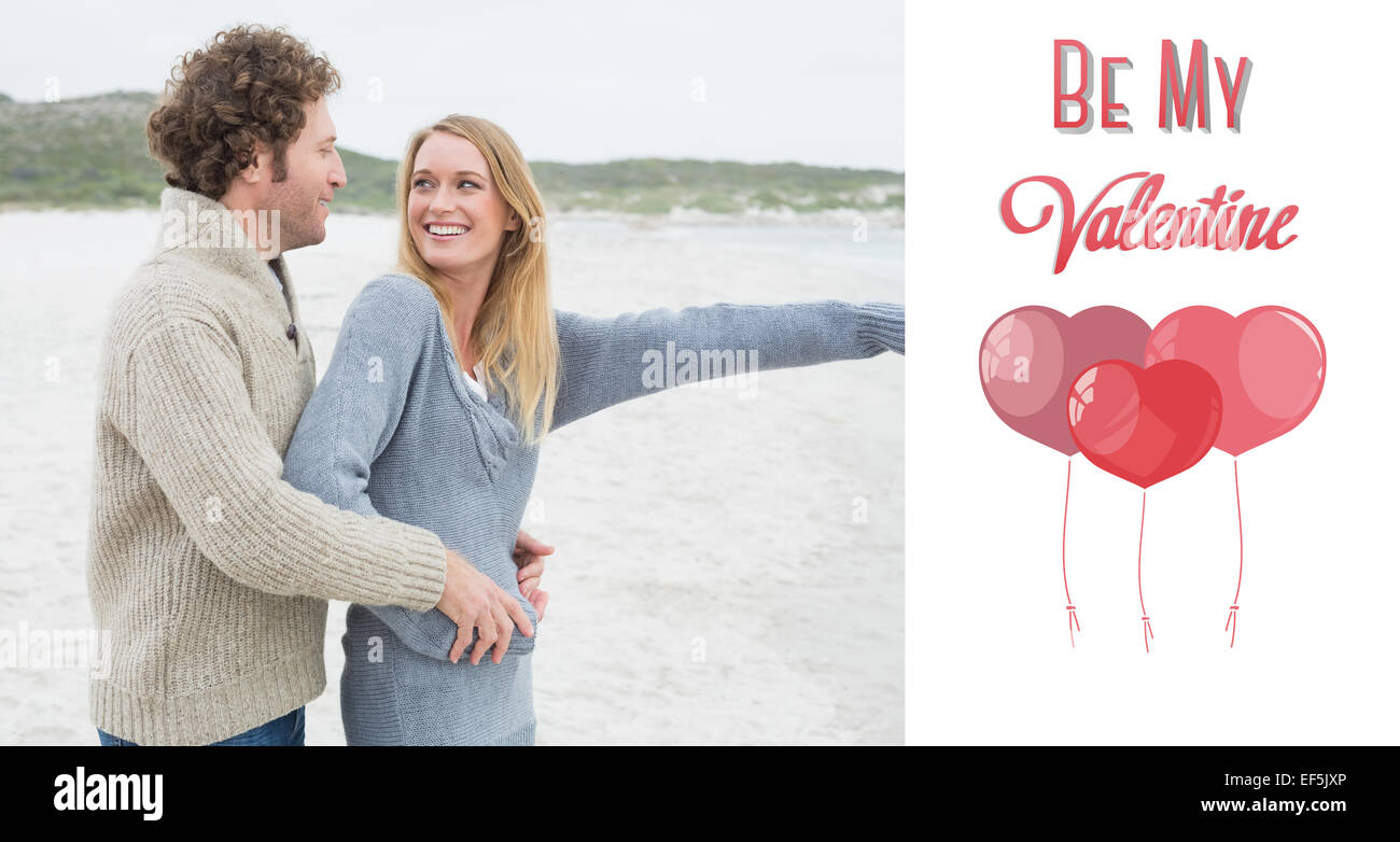 Composite image of side view of a relaxed romantic couple at beach Stock Photo