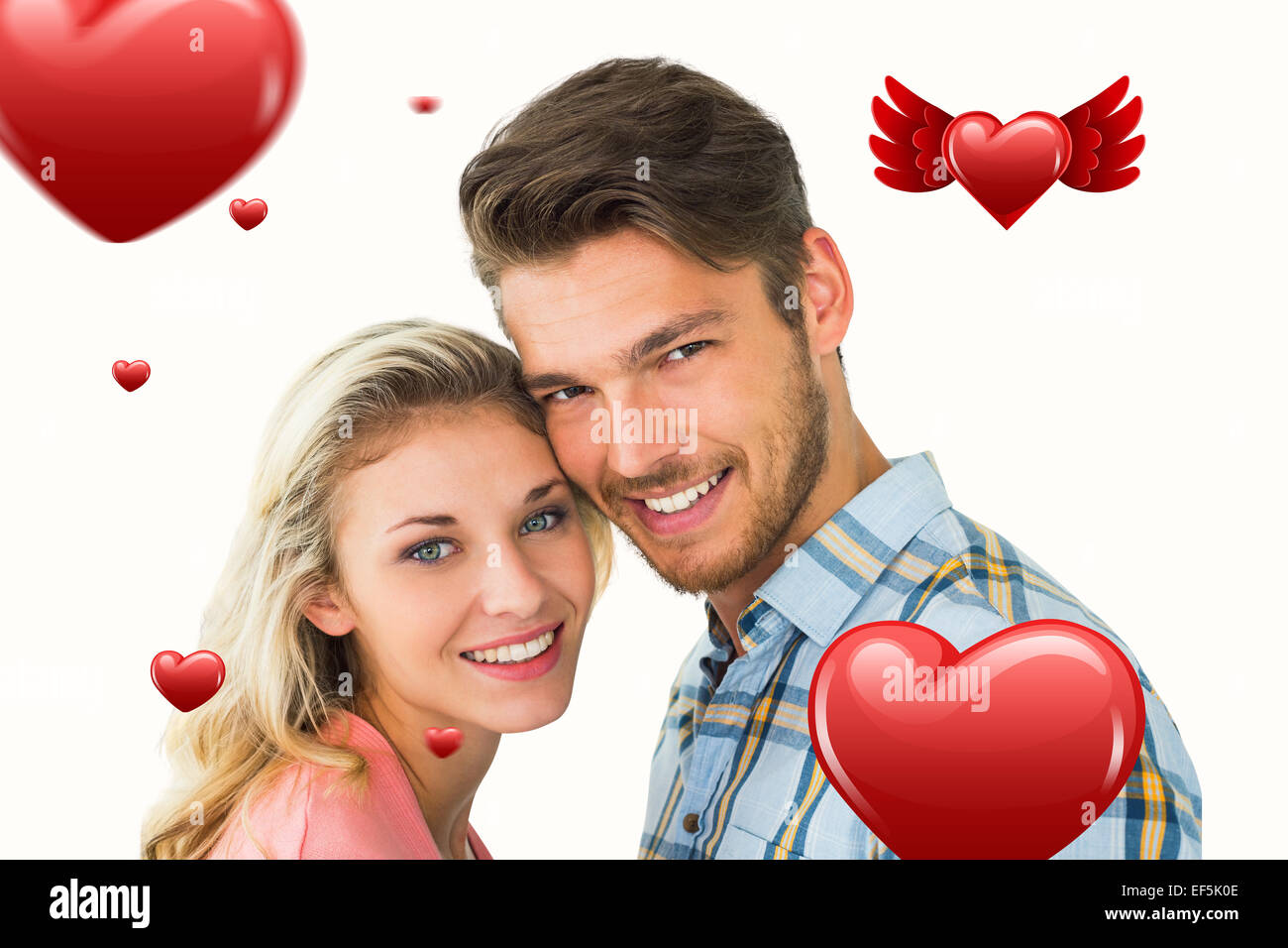 Composite image of attractive couple smiling at camera Stock Photo - Alamy