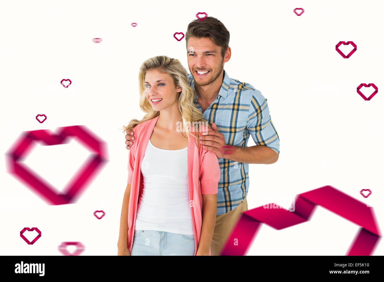 Composite image of attractive young couple smiling together Stock Photo ...