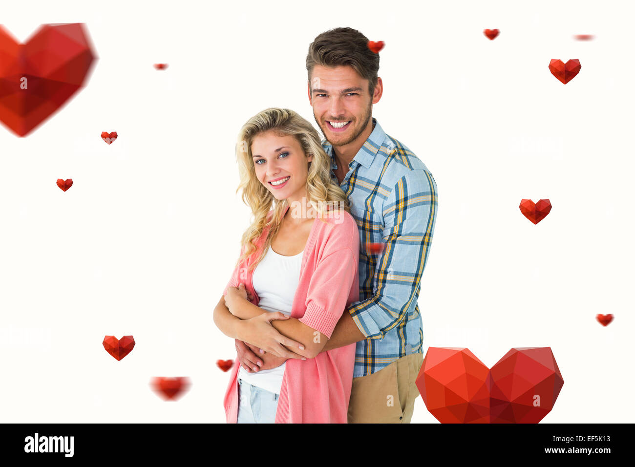 Composite image of attractive young couple smiling at camera Stock ...