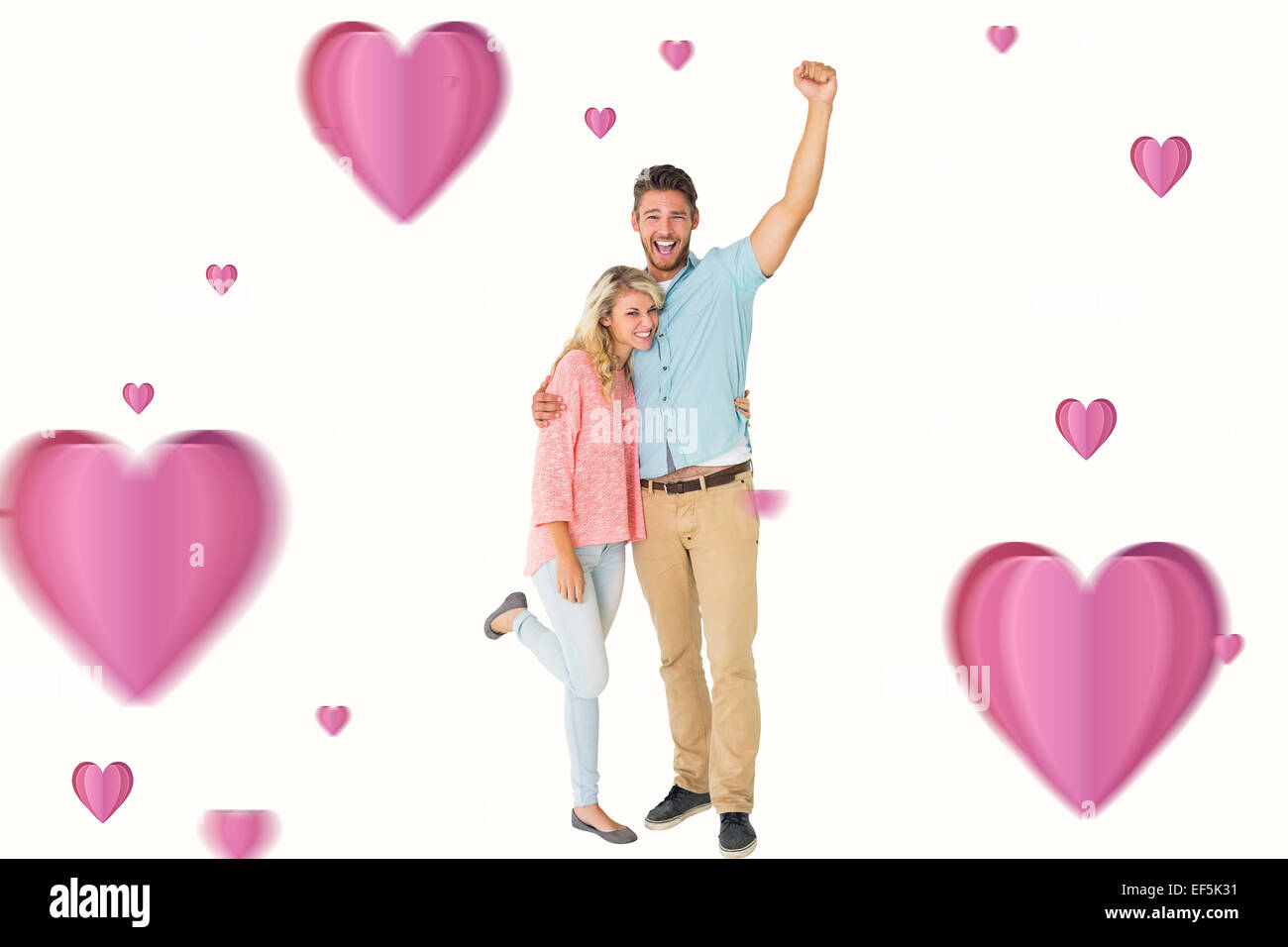 Composite image of attractive couple smiling and cheering Stock Photo ...