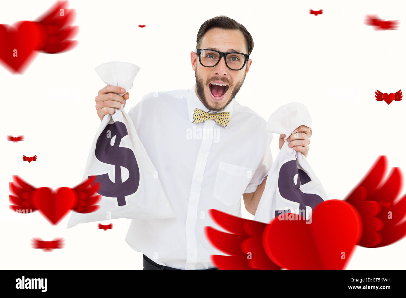 Composite image of geeky businessman holding money bags Stock Photo
